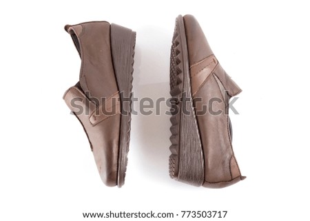 Female brown leather shoe on white background, isolated product, comfortable footwear.