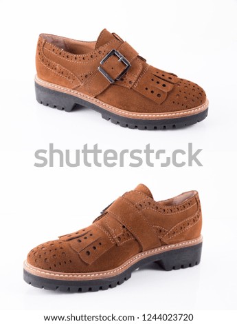 Female brown leather shoes on white background, isolated product, comfortable footwear.