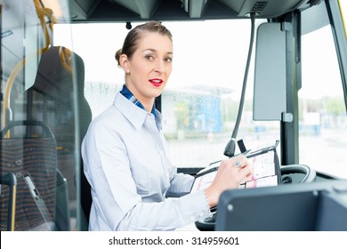Female Bus Driver In Drivers Seat