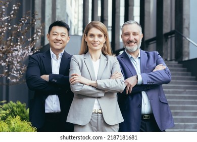 Female Business Boss And Her Diverse Team, Asian Man Looking At Camera With Crossed Arms And Smiling, Dream Team Outside Office Building