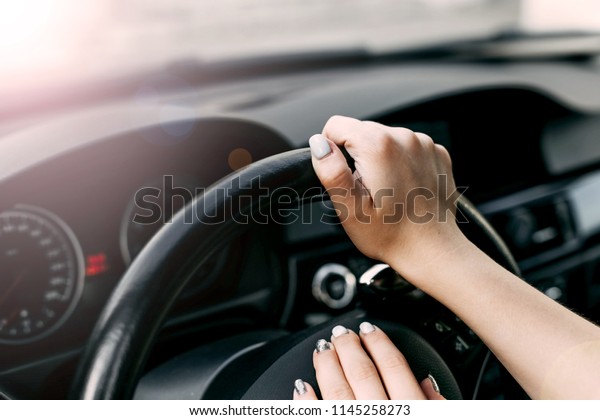 female business car\
driver. hands  girl.