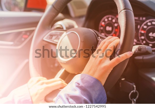 Female business car\
driver, hands girl