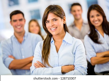 Female Business Leader With Her Team At The Office