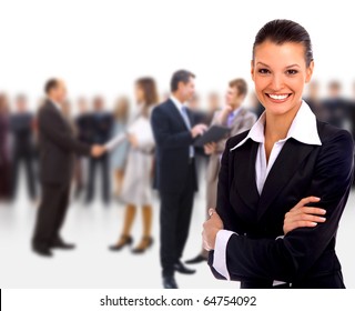 Female Business Leader Standing In Front Of Her Team