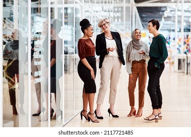 Female business people or Friends - Diverse Group of Females Only in a modern Office discussing and laughing. Multi ethnic natural group of business people with age diversity in a modern company - Shutterstock ID 2117721485