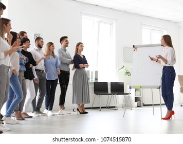 Female business trainer giving lecture in office