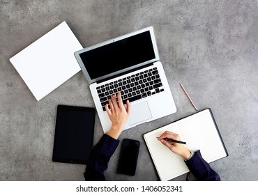 Female Business Woman Typing On A Modern Laptop, Laptop With Office Stationery Top View Against Plain Background - Image