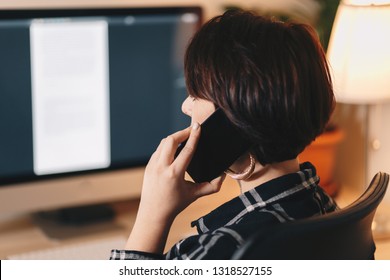 Female Businesswoman Working From A Home Office, Private Workspace. Face Hidden From The Camera