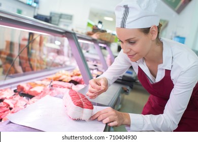 Female Butchers In A Supermarket At Work