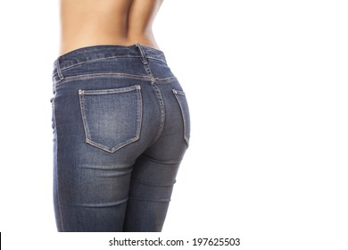 Female Buttocks In Jeans On A White Background