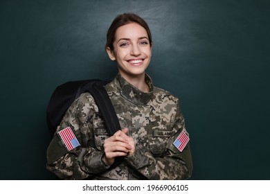 Female Cadet With Backpack Near Chalkboard. Military Education