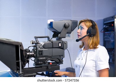 Female Cameraman Studio Smiles Into Camera Stock Photo 57509311 ...