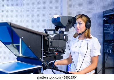 Female Cameraman Studio Smiles Into Camera Stock Photo 57509311 ...