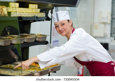 Female Canteen Worker Preparing The Tray