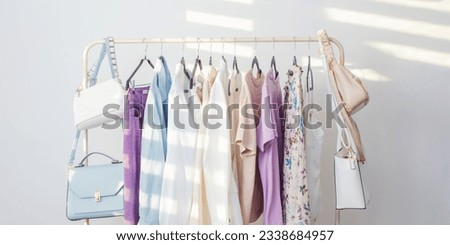 female  capsule summer wardrobe in  white room