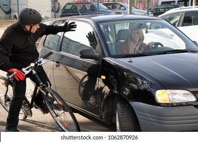 Female Car Driver Puts A Cyclist In A Dangerous Situation Near The Accident In Traffic