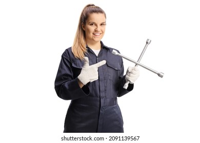 Female Car Mechanic Holding A Lug Wrench And Pointing Isolated On White Background



