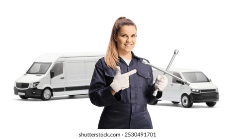 Female car mechanic with vans holding a lug wrench and pointing isolated on white background



 - Powered by Shutterstock