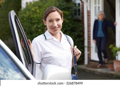 Female Care Worker Visiting Senior Woman At Home
