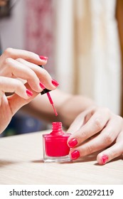 Female Carefully Painting Her Fingernails.