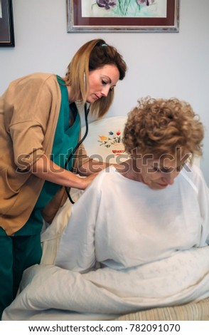 Similar – Caregiver helping elderly patient to stand up