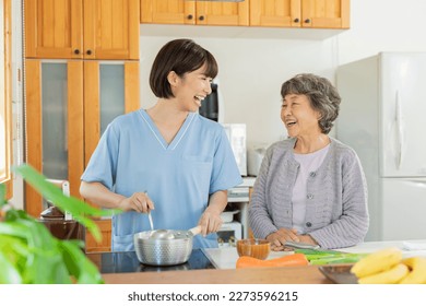 Female caregiver preparing meals for patients - Powered by Shutterstock