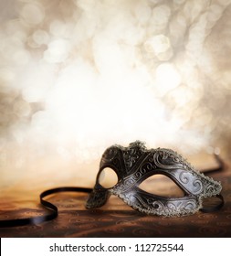 female carnival mask with glittering background - Shutterstock ID 112725544