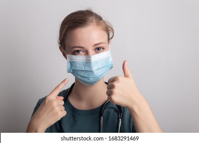 Female caucasian doctor nurse woman wearing surgical mask
