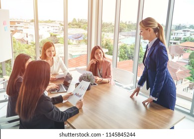 A female Caucasian manager with female Asian employee during the meeting/briefing. - Shutterstock ID 1145845244