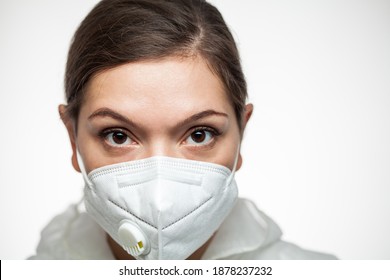 Female Caucasian Medical Worker Wearing PPE N95 Face Mask And Protective Suit,closeup Portrait,front Line First Responder Doctor Surgeon,Intensive Care Unit Emergency Medical Services Hospital Staff 