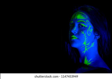 Female Caucasian Model With Plant Inspired Green Blacklight Paint Glowing.