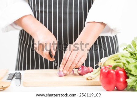 Female Chef Holding Wooden Spoon.  Isolated white background
