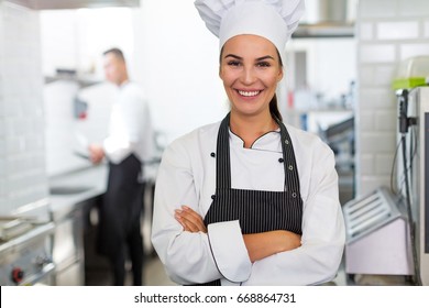 Female chef in kitchen
