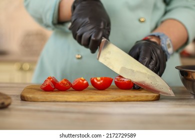 Female Chef Prepares Italian Pasta With Tomatoes And Permesan In A Bright Kitchen In A Rustic Style. Mint Coat Apron. Chef At Home