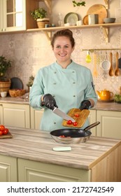 Female Chef Prepares Italian Pasta With Tomatoes And Permesan In A Bright Kitchen In A Rustic Style. Mint Coat Apron. Chef At Home