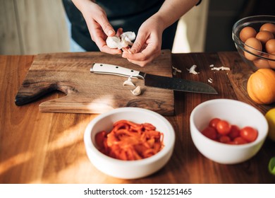 Female Chef Preparing A Dish In The Kitchen