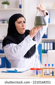 Female Chemist In Hijab Working In The Lab