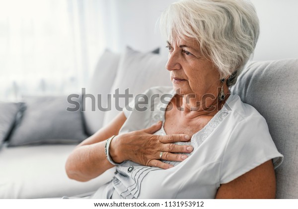 Female with chest pain. Senior woman\
suffering from heartburn or chest discomfort symptoms. Acid reflux\
or Gastroesophageal reflux disease (GERD)\
concept