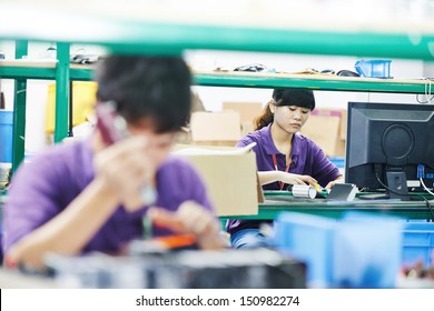 Female Chinese Worker Woman Assembling Production At Line Conveyor In China Factory Manufacturing