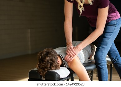 Female Chiropractor Performing Myofascial Release.