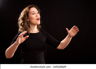 Female Choir Conductor During Performance