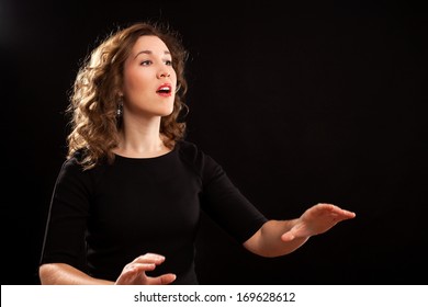 Female Choir Conductor During Performance