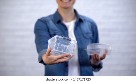 Female choosing bioplastic food container instead non-disposable box, pollution