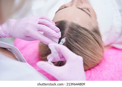 Female Client Getting Injection Into Scalp During Mesotherapy