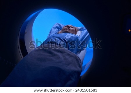 Female client is undergoing computed tomography of abdomen