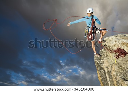 Similar – Climber reaching for a helping-hand.