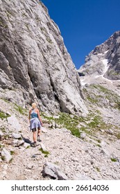female climbing ferrata in julian alps, slovenia