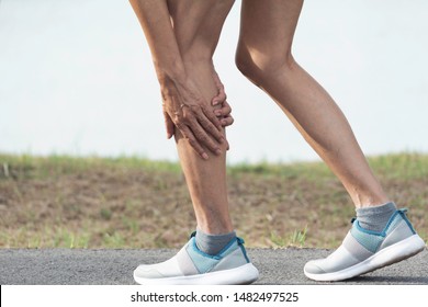 The female clings to a bad leg. The pain in her leg. Health and painful concept. - Shutterstock ID 1482497525