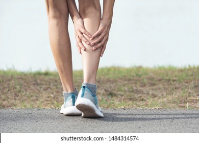 The female clings to a bad leg. The pain in her leg. Health and painful concept. - Shutterstock ID 1484314574