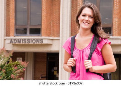 Female College Student With Backpack Leaving Admissions Office At University.